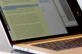 Laptop on Table Writing a Blog Post