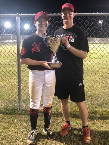 Rick and son at a baseball tournament