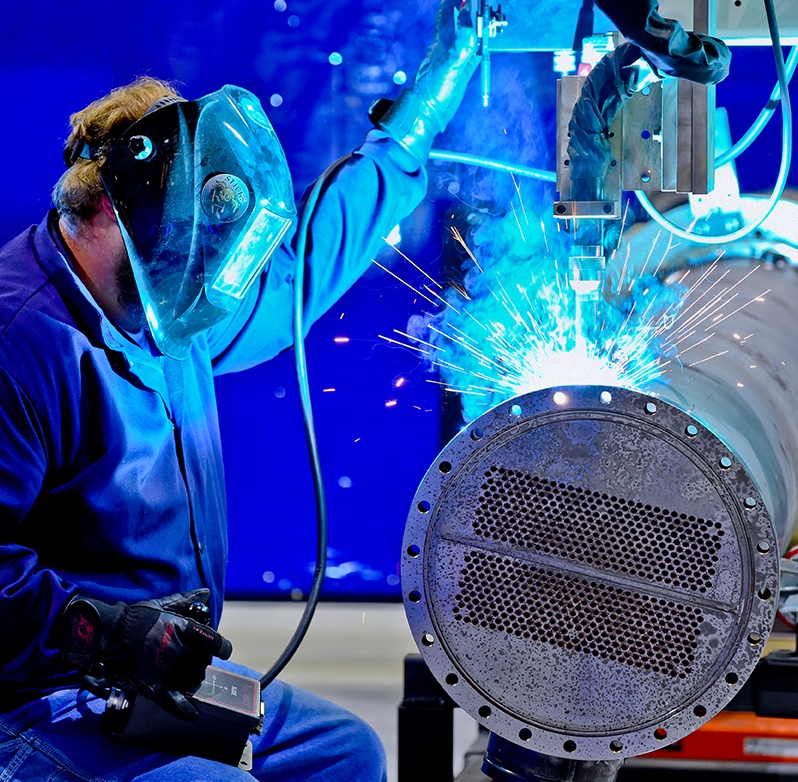 Photo of factory worker welding
