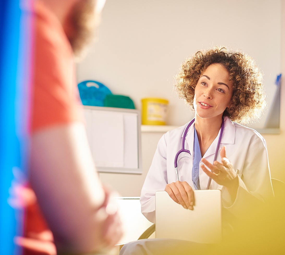 Photo of healthcare provider talking to a patient